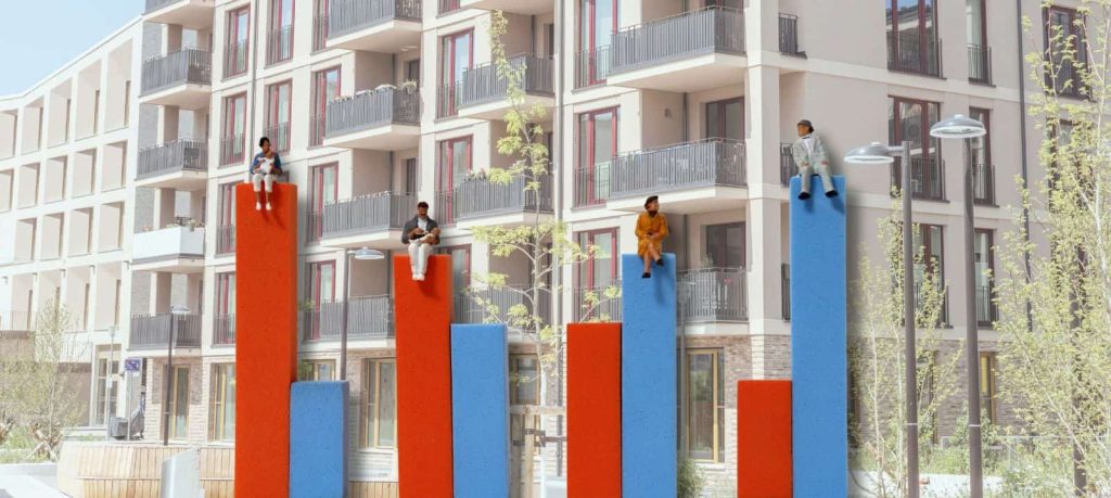 Stilizovani dijagram demografskih promena i stambena zgrada u pozadini